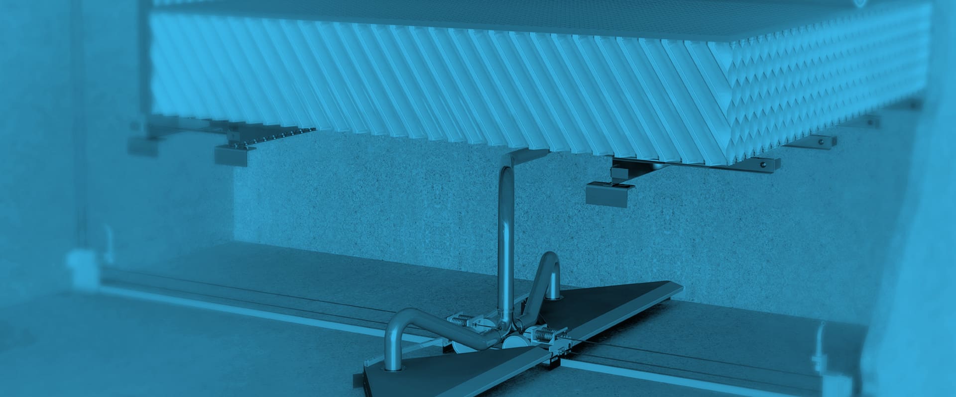 A blue-tinted image showcases an industrial filtration system featuring pleated filters supported by metal brackets and pipes.