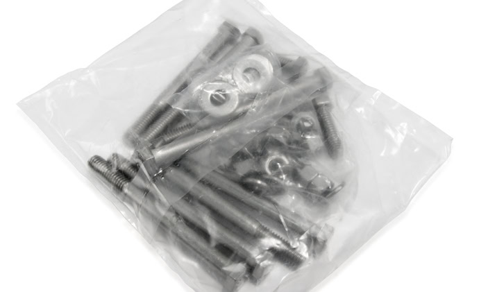 A sealed clear plastic bag containing various metallic bolts, screws, and washers.