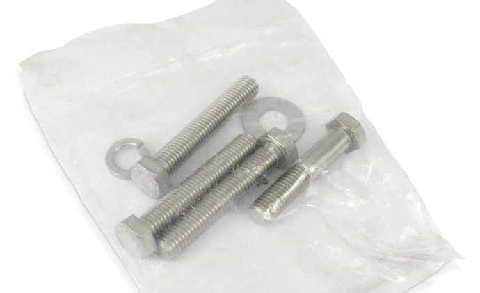 A small plastic bag containing three metal bolts, two washers, and two nuts on a white background.