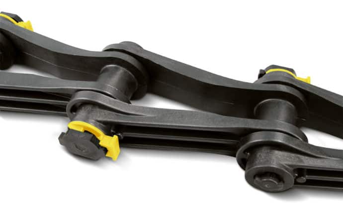 Close-up of a black mechanical linkage system with yellow accents. The collector chain structure features interconnected rotating joints and cylindrical components.