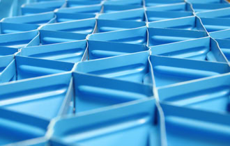 Close-up of an abstract pattern composed of blue plastic triangular shapes from the IFR-6000 Series.