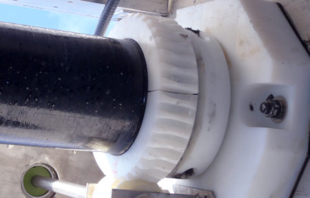 a close up featuring the wall bearing assembly that belongs to a rotating trough