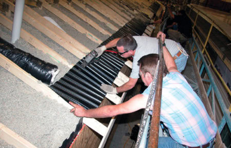 an image showing two technicians installing accuvent for manufactured homes