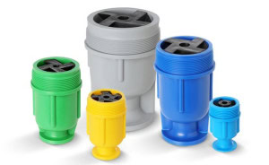 Various sizes of colorful SPN Spray Nozzles arranged in a row. The nozzles are cylindrical with threaded tops and star-shaped openings. They come in green, yellow, gray, blue, and teal, ranging from small to large.