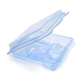 A clear, open plastic clamshell packaging container is shown. The lid is partially open, revealing a compartmentalized interior designed to securely hold and display consumer products.