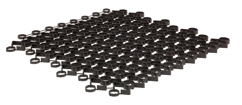 A black, grid-like plastic structure comprising interconnected circular cells. Uniformly arranged in rows and columns, it forms a flat, flexible mat ideal for stormwater management.