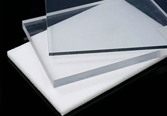 Two transparent sheets, crafted from premium PC, are layered atop a white sheet on a black background.