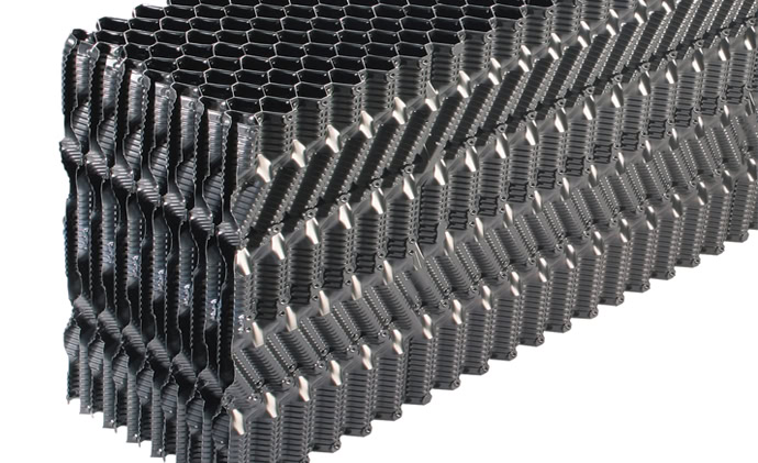 Close-up image of a black hexagonal honeycomb structure, showcasing its geometric, interlocking cells in a detailed pattern. The material appears metallic and is stacked in layers, with the OF21MA model demonstrating consistency in the shape and size of the honeycomb cells.